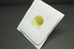 The mold is papered with a thin Kevlar fabric coated with resin