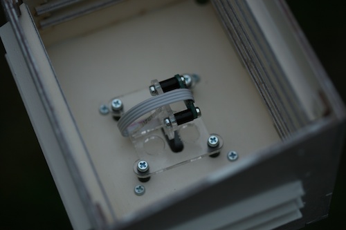 The sensor in its box, mounted vertically