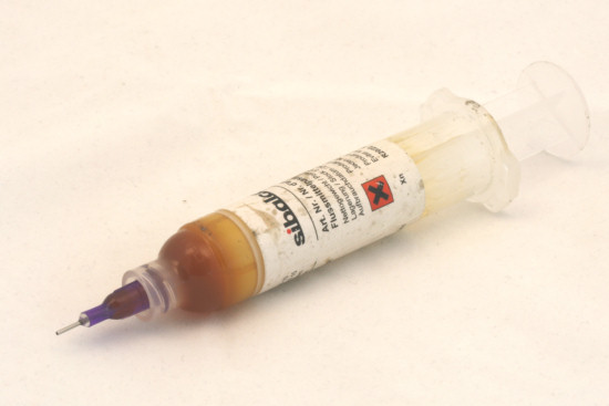 A syringe of flux cream