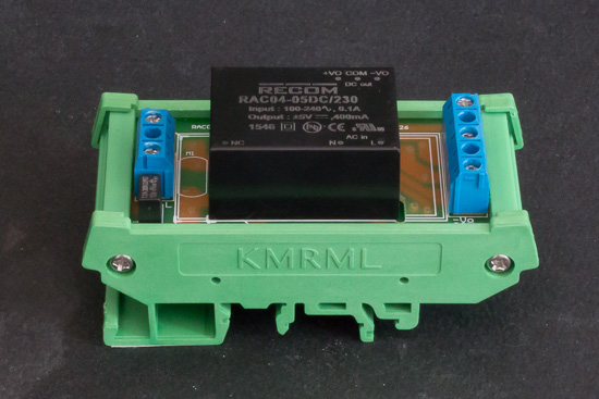 The power supply is composed of a RAC04-05DC/230 module and of a RAC-DIN-Rail mounting board, both from Recom